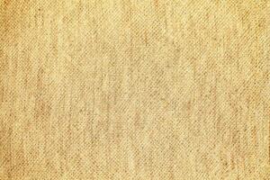 Natural Linen Material Textile Canvas Fabric Texture Background Close-up Detail of Fabric Natural Color Hemp Material Pattern Design Wallpaper. Can be Used as Background or For Graphic Design photo