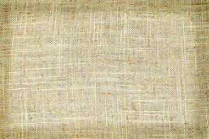 Natural Linen Material Textile Canvas Fabric Texture Background Close-up Detail of Fabric Natural Color Hemp Material Pattern Design Wallpaper. Can be Used as Background or For Graphic Design photo