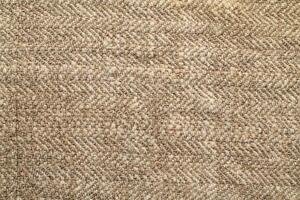 Natural Linen Material Textile Canvas Fabric Texture Background Close-up Detail of Fabric Natural Color Hemp Material Pattern Design Wallpaper. Can be Used as Background or For Graphic Design photo