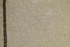 Natural Linen Material Textile Canvas Fabric Texture Background Close-up Detail of Fabric Natural Color Hemp Material Pattern Design Wallpaper. Can be Used as Background or For Graphic Design photo