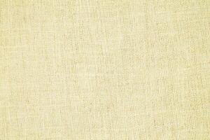 Natural Linen Material Textile Canvas Fabric Texture Background Close-up Detail of Fabric Natural Color Hemp Material Pattern Design Wallpaper. Can be Used as Background or For Graphic Design photo