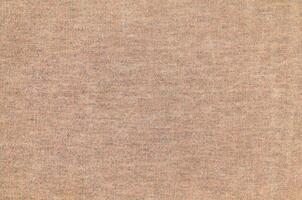 Natural Linen Material Textile Canvas Fabric Texture Background Close-up Detail of Fabric Natural Color Hemp Material Pattern Design Wallpaper. Can be Used as Background or For Graphic Design photo