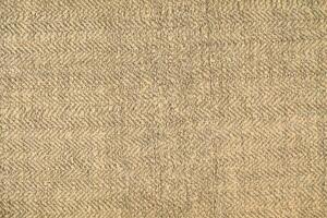 Natural Linen Material Textile Canvas Fabric Texture Background Close-up Detail of Fabric Natural Color Hemp Material Pattern Design Wallpaper. Can be Used as Background or For Graphic Design photo