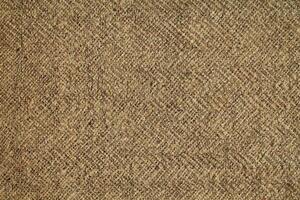Natural Linen Material Textile Canvas Fabric Texture Background Close-up Detail of Fabric Natural Color Hemp Material Pattern Design Wallpaper. Can be Used as Background or For Graphic Design photo