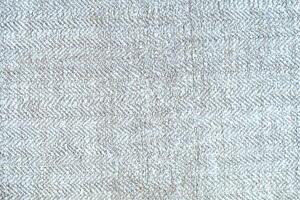 Natural Linen Material Textile Canvas Fabric Texture Background Close-up Detail of Fabric Natural Color Hemp Material Pattern Design Wallpaper. Can be Used as Background or For Graphic Design photo