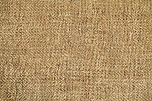 Natural Linen Material Textile Canvas Fabric Texture Background Close-up Detail of Fabric Natural Color Hemp Material Pattern Design Wallpaper. Can be Used as Background or For Graphic Design photo