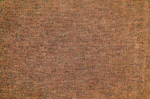 Natural Linen Material Textile Canvas Fabric Texture Background Close-up Detail of Fabric Natural Color Hemp Material Pattern Design Wallpaper. Can be Used as Background or For Graphic Design photo