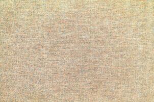 Natural Linen Material Textile Canvas Fabric Texture Background Close-up Detail of Fabric Natural Color Hemp Material Pattern Design Wallpaper. Can be Used as Background or For Graphic Design photo
