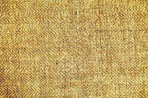 Natural Linen Material Textile Canvas Fabric Texture Background Close-up Detail of Fabric Natural Color Hemp Material Pattern Design Wallpaper. Can be Used as Background or For Graphic Design photo