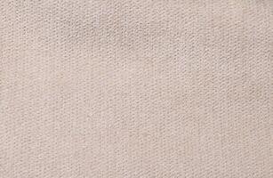 Natural Linen Material Textile Canvas Fabric Texture Background Close-up Detail of Fabric Natural Color Hemp Material Pattern Design Wallpaper. Can be Used as Background or For Graphic Design photo
