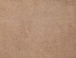 Natural Linen Material Textile Canvas Fabric Texture Background Close-up Detail of Fabric Natural Color Hemp Material Pattern Design Wallpaper. Can be Used as Background or For Graphic Design photo