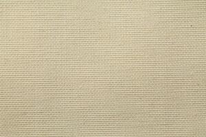 Natural Linen Material Textile Canvas Fabric Texture Background Close-up Detail of Fabric Natural Color Hemp Material Pattern Design Wallpaper. Can be Used as Background or For Graphic Design photo