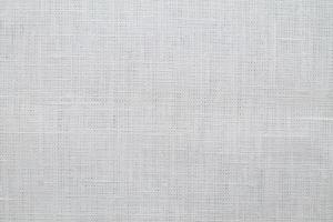 Natural Linen Material Textile Canvas Fabric Texture Background Close-up Detail of Fabric Natural Color Hemp Material Pattern Design Wallpaper. Can be Used as Background or For Graphic Design photo