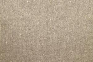 Natural Linen Material Textile Canvas Fabric Texture Background Close-up Detail of Fabric Natural Color Hemp Material Pattern Design Wallpaper. Can be Used as Background or For Graphic Design photo