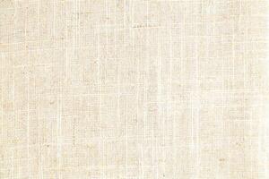Natural Linen Material Textile Canvas Fabric Texture Background Close-up Detail of Fabric Natural Color Hemp Material Pattern Design Wallpaper. Can be Used as Background or For Graphic Design photo
