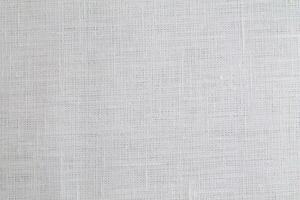 Natural Linen Material Textile Canvas Fabric Texture Background Close-up Detail of Fabric Natural Color Hemp Material Pattern Design Wallpaper. Can be Used as Background or For Graphic Design photo