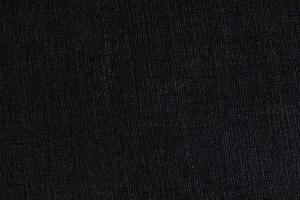 Natural Linen Material Textile Canvas Fabric Texture Background Close-up Detail of Fabric Natural Color Hemp Material Pattern Design Wallpaper. Can be Used as Background or For Graphic Design photo