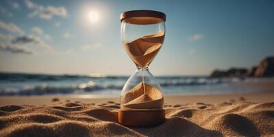 A glass hourglass with sand in it is half full. photo