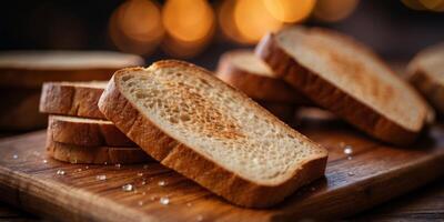 Close-Up of Freshly Toasted Bread Slices on Wooden Board. photo
