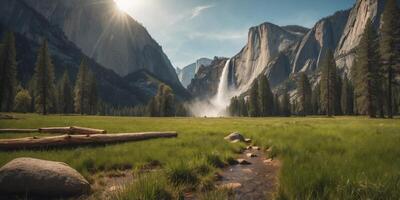 Yosemite meadow panorama with green grass and powerful waterfall. photo