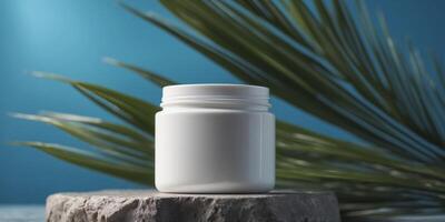 A white jar of moisturizer on a stone platform with a palm leaf and blue background. photo