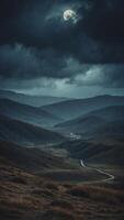 epic gloomy landscape close up moonlight breaks through heavy clouds and illuminates sections of the gloomy valley. photo