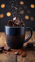 Chunks of Dark Chocolate in a Mug on Wooden Table. photo