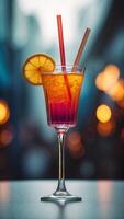 A glass of a colorful drink with a straw in it. photo