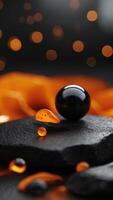 A black and orange background with a small object in the foreground. photo