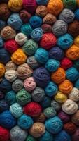 A blue background with a variety of different colored yarns. photo