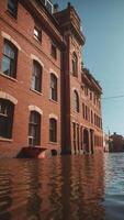 Old red brick building flooded with sun and traffic light. photo