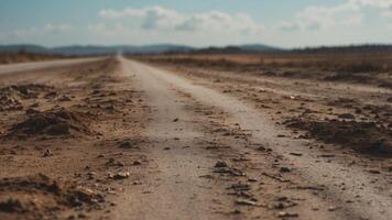 A blurry image of a road with a lot of dirt and debris. photo