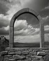 Old Stone Window Frame with Cloudy Sky View in Black and White. photo