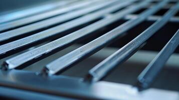 The next image shows a vent with a rectangular shape featuring a series of small movable slats that can be adjusted to control the direction of the air flow photo