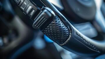 A low angle shot of a parking brake lever showcasing its textured and ergonomic grip for easy use photo
