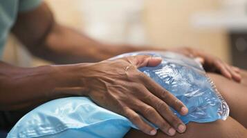 A the gently applying ice packs to a clients sore shoulder photo
