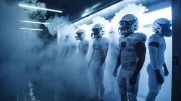 A group of football players standing in a line each taking turns standing in a cryotherapy chamber with liquid nitrogen vapor surrounding their bodies photo