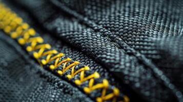 A closeup of the stitching along the edges of a car cover highlighting its reinforced durability photo