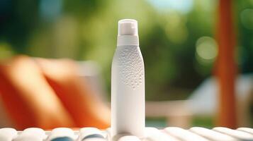 Closeup of a white sunscreen bottle with droplets of lotion on the nozzle. photo
