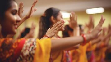 Closeup of synchronized hand gestures during a traditional dance lesson photo