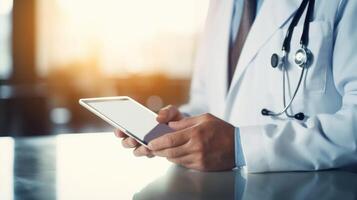 Detailed shot of a doctors hand inputting new patient data into a digital tablet and reviewing the changes. photo