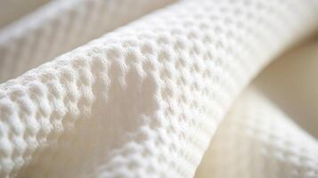 Detail of a textile woven from organic cotton, creating a subtle and elegant pattern. photo