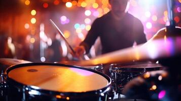 Closeup of a drummers intense expression as they play along to the virtual concert. photo