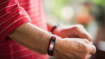 Macro closeup of an elderly persons wrist with a fitness tracker bracelet, linked to a health monitoring app. photo