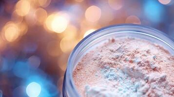 Closeup of a highlighting powder, giving off an ethereal glow, inspired by the glistening mermaids in Pirates of the Caribbean. photo