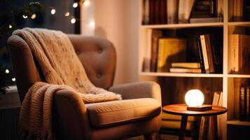 Closeup of a cozy reading corner with a comfortable armchair and a small bookshelf in a tiny house office. photo