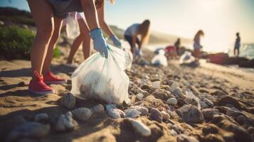 Closeup of a group of teenagers collecting trash from a beach, part of a youthled coastal cleanup initiative. photo