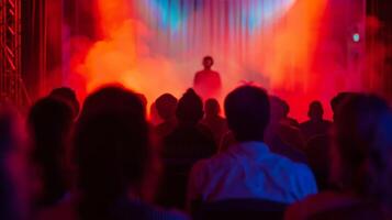 The performers on stage are blurred into the background a haunting backdrop for the audience photo