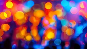 Hazy figures dancing and singing along to the music on stage photo