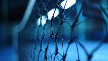 A soft focus on the net captures the tension and suspense of a close match photo
